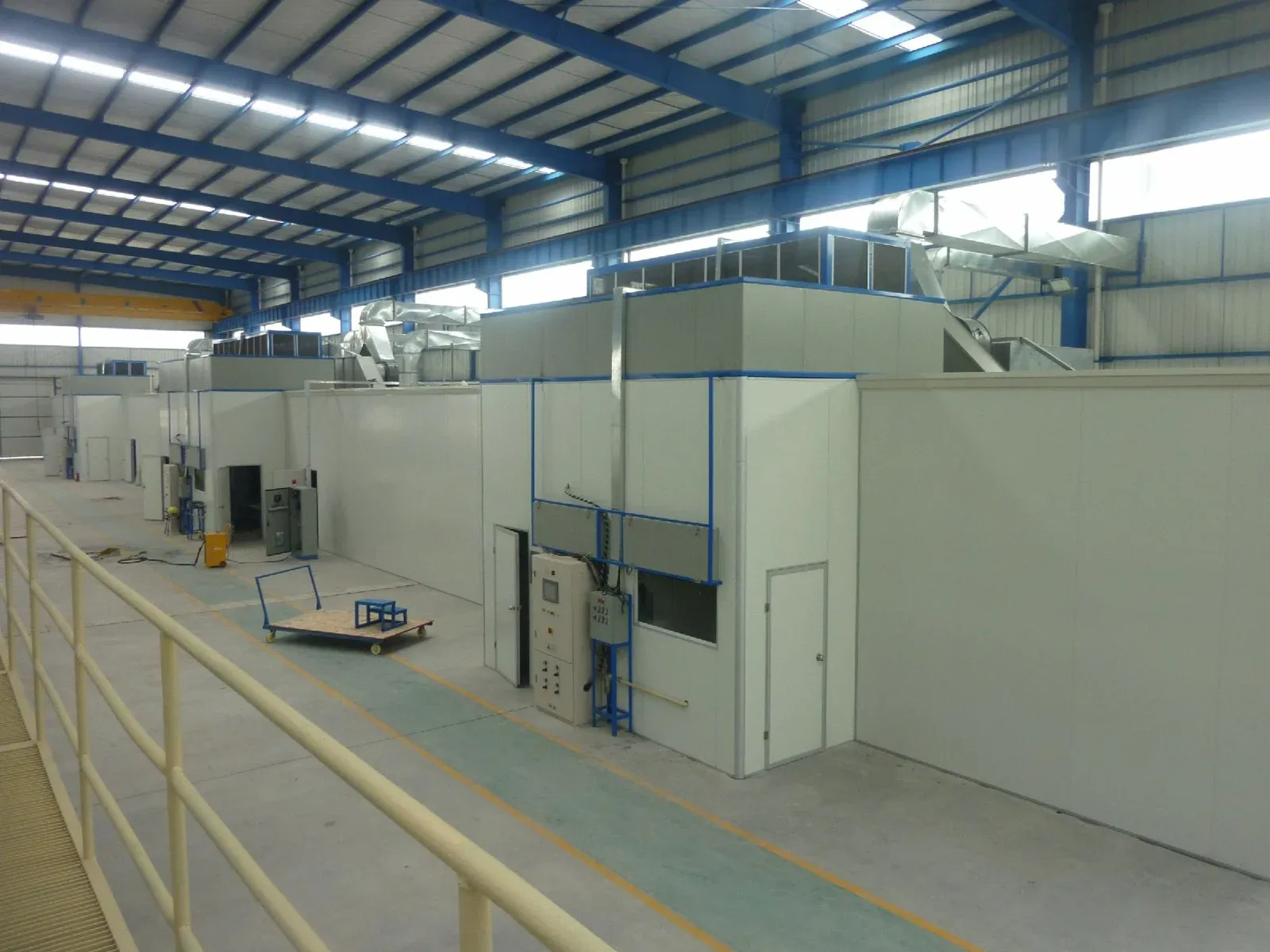 Aluminum panels on an XFS Equipment electrostatic powder coating line