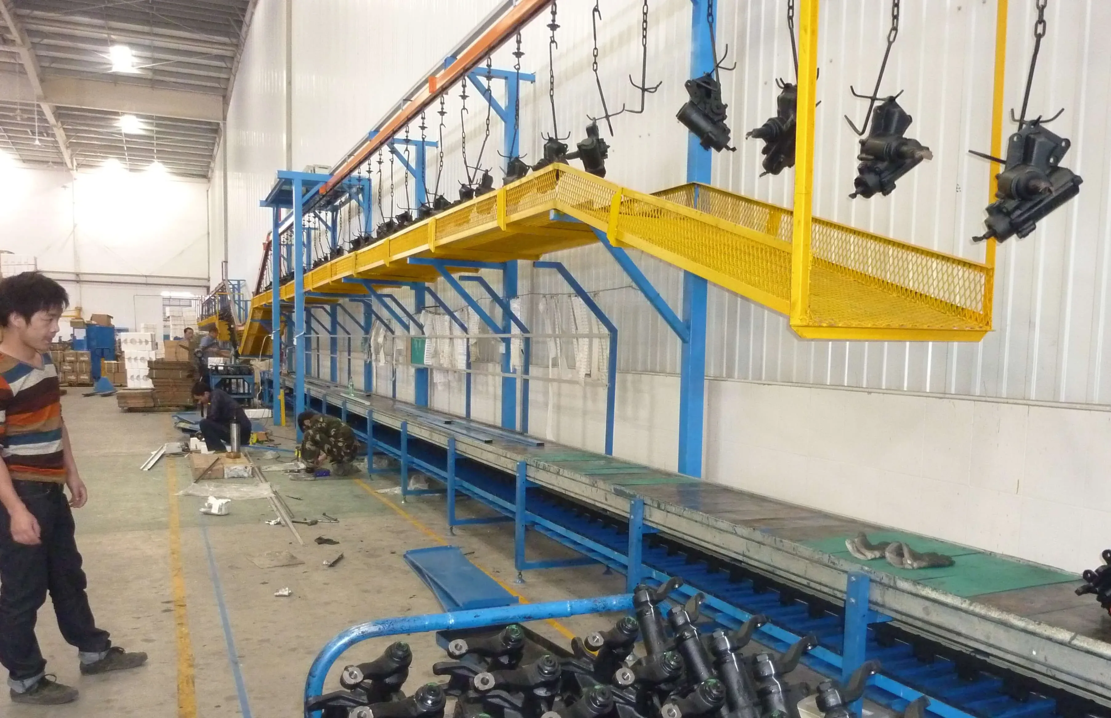 Overhead chain conveyor for an XFS Equipment finishing line