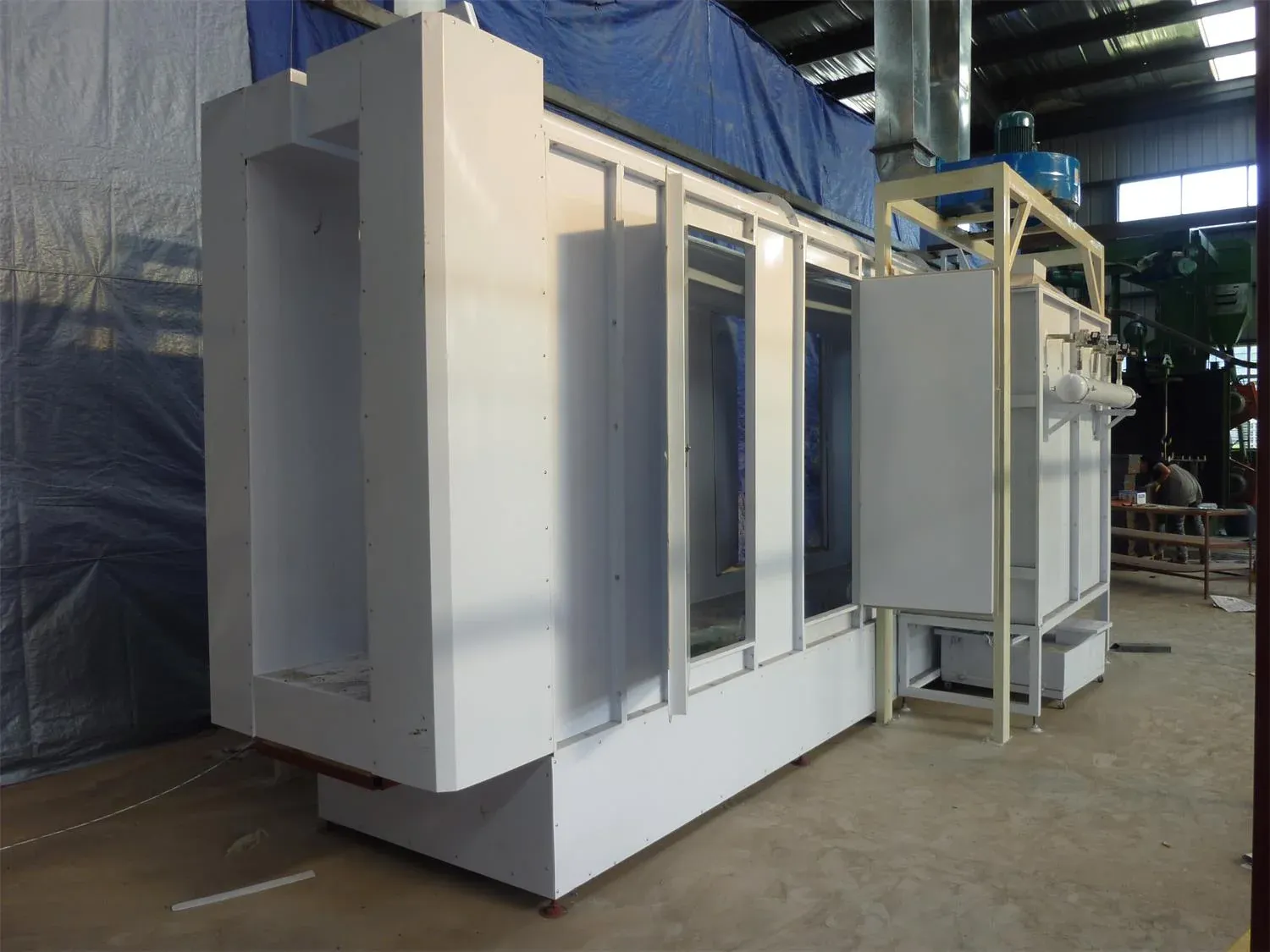 Pass-through powder spray booth on an XFS Equipment coating line