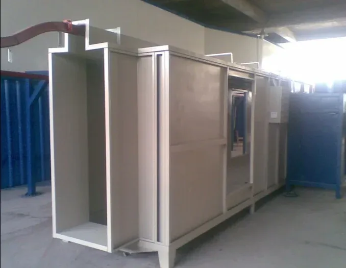 Interior of a pass-through powder spray booth