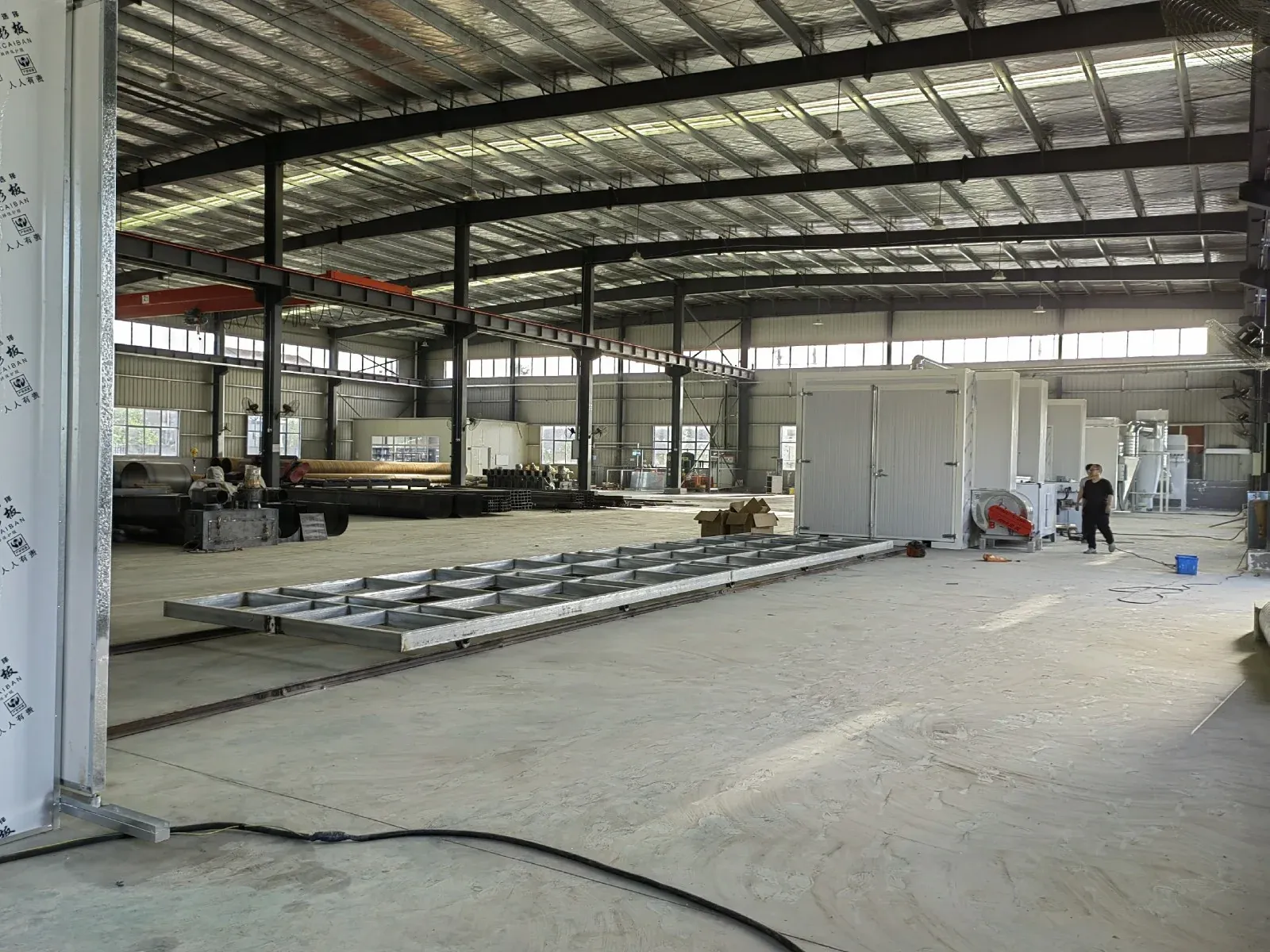 Fabricated metal products on a powder coating conveyor